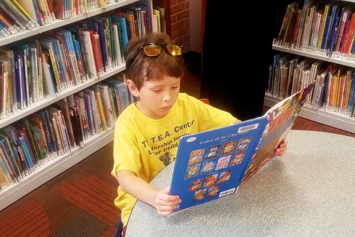 A Library & Gross Motor Area Support Their Budding Interests 1